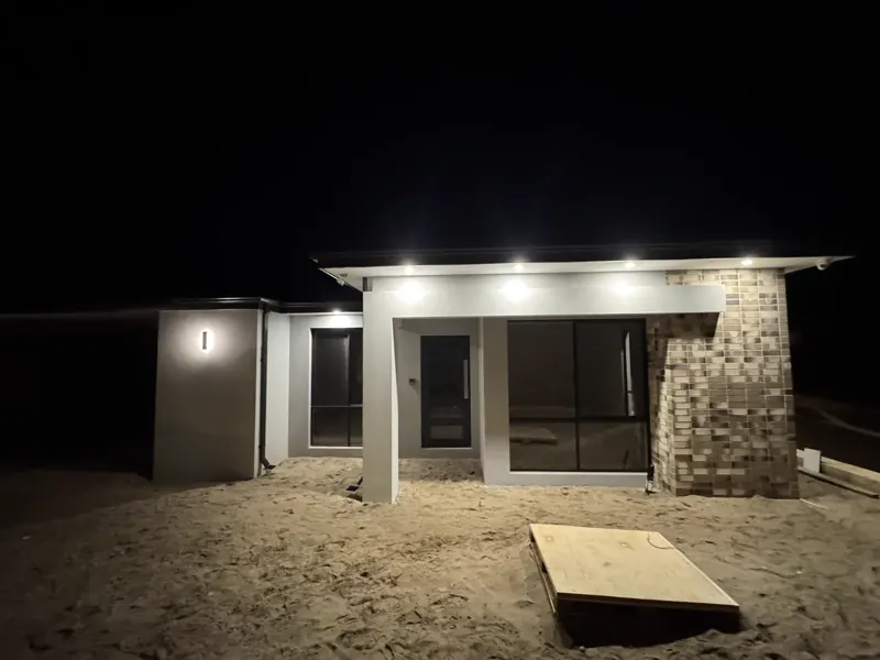 Alfresco downlights installed by Calabreeze glowing at night
