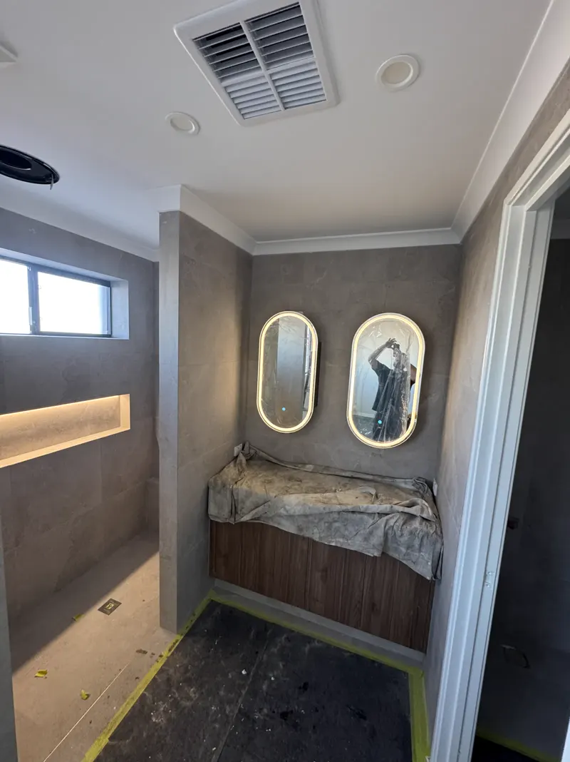 Ensuite renovation with LED mirrors wired by Calabreeze