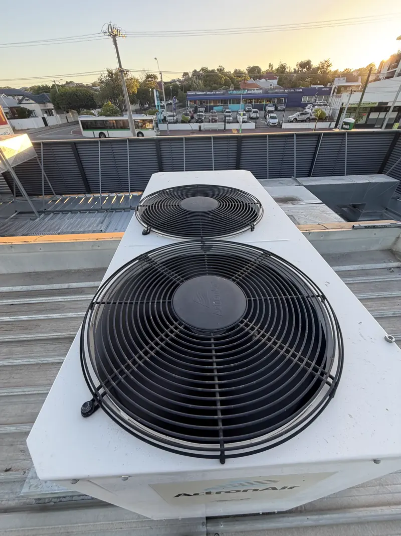 Rooftop package air-conditioning unit at sunset over Perth