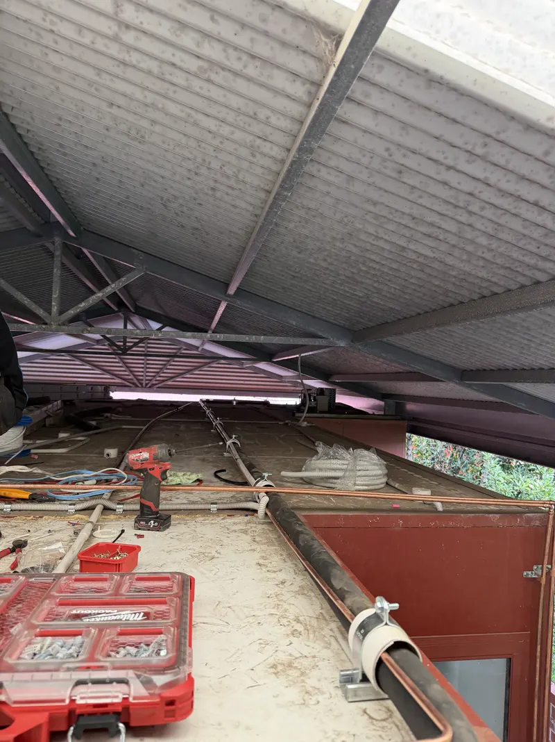 Shed lighting and wiring installation in progress